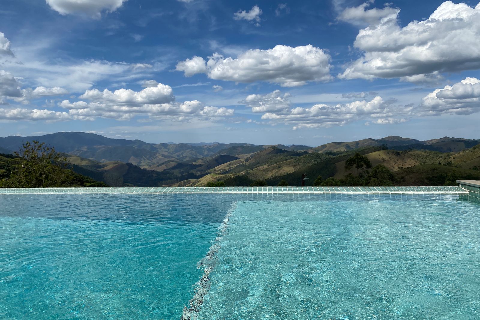 Twilight Pool with Water Features – [City]